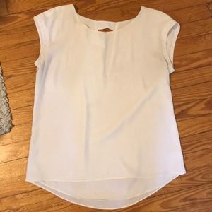 White Express top with cut out in back